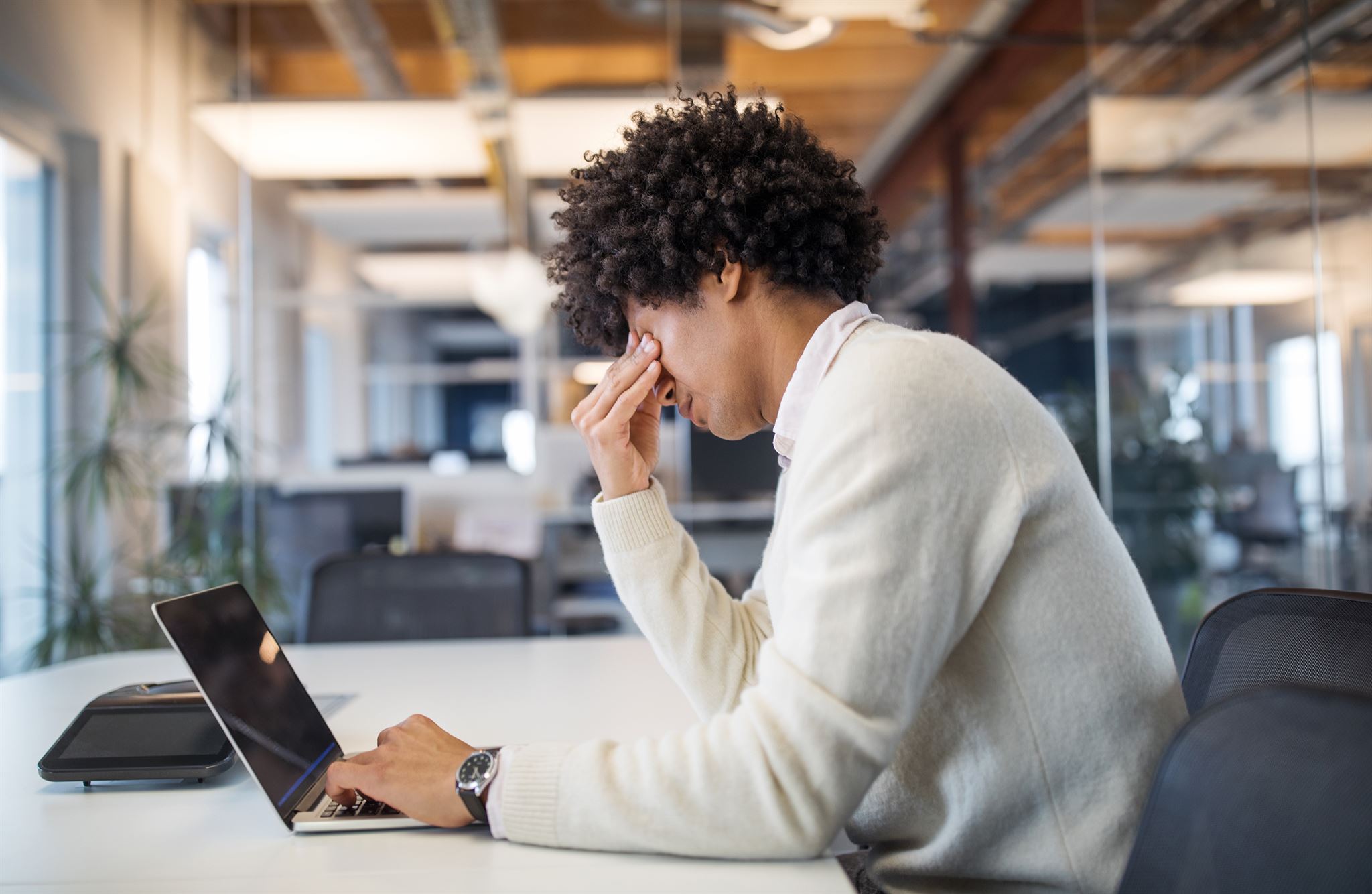 Stress-free business owner working on laptop